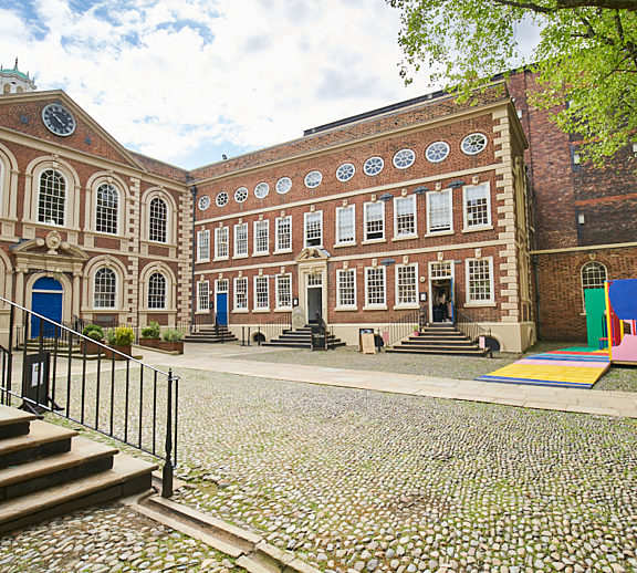 Image shows the Bluecoat building from the courtyard, with Bluecoat Platform, a colourful sculpture, in the right hand corner.