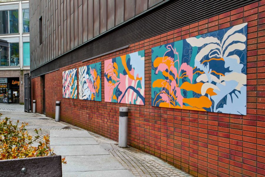 A large colourful mural is shown along Bluecoat's external brick wall.