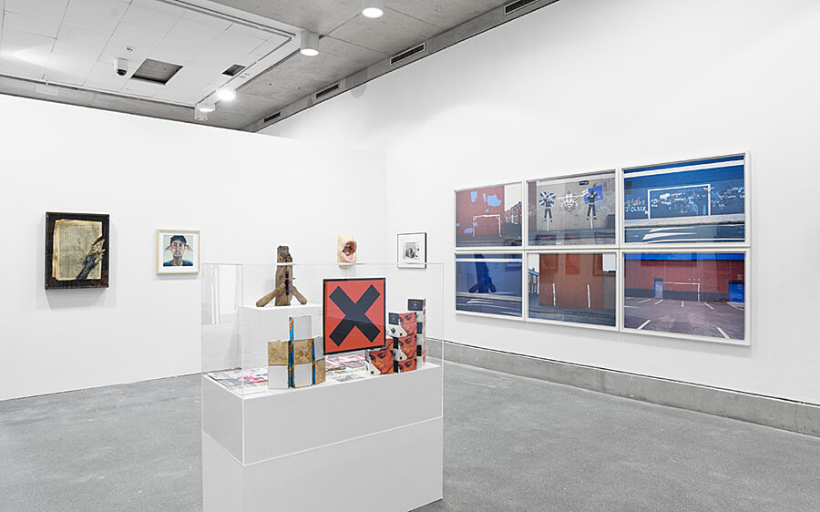 Public View (2017). Visible behind The Trophy Cabinet is part of Juginder Lamba’s wooden sculpture The Cry.