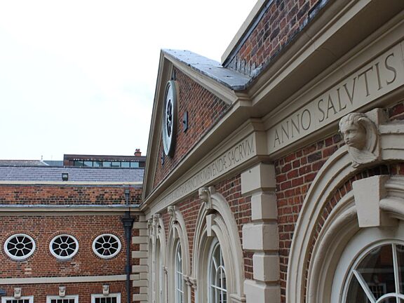 Latin inscription on the front of the building