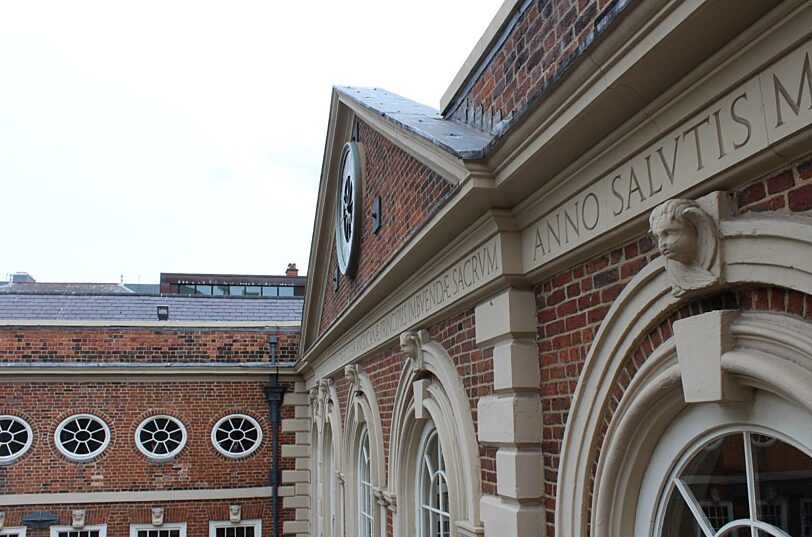 Latin inscription on the front of the building